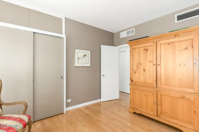 a view of a bedroom with closet area