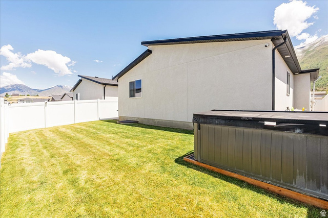 3916 South Sage Wood Avenue Mapleton, UT 84664 - Photo 31 of 33 Manicured lawn framed by a white privacy fence