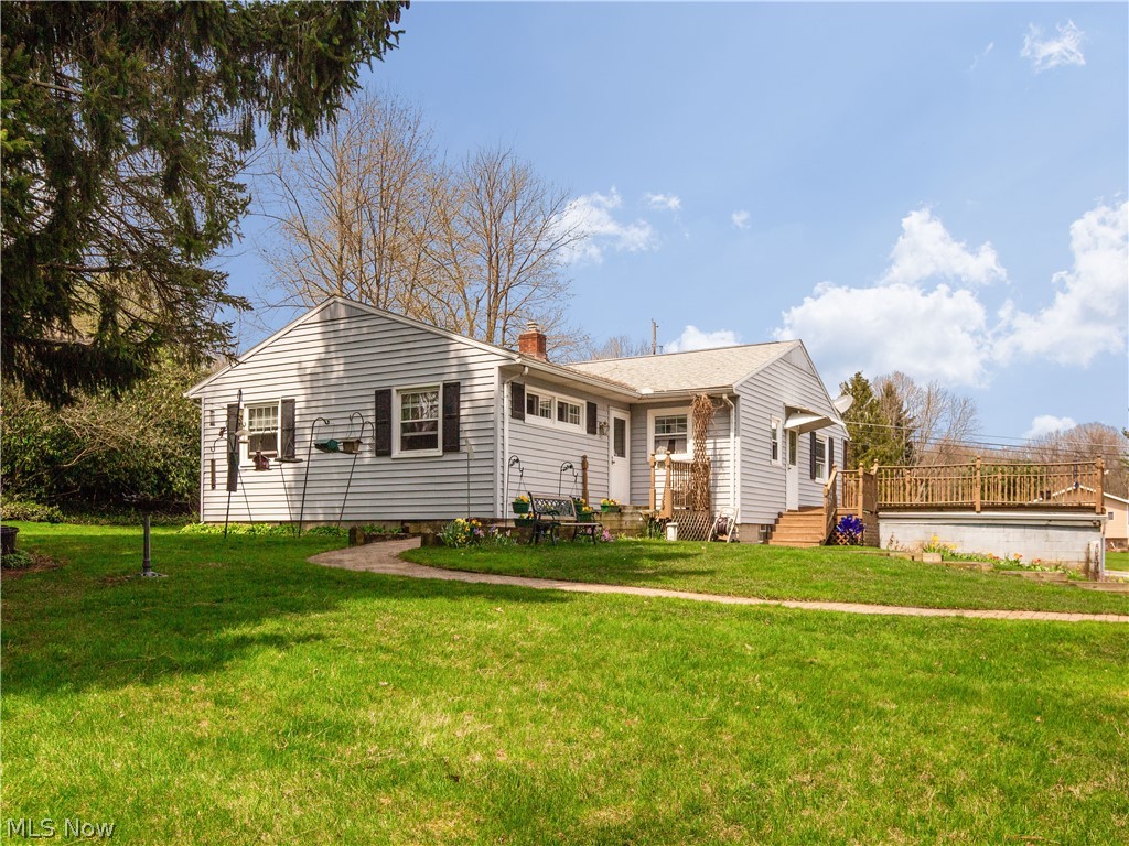 288 Yager Road Clinton, OH 44216 - Photo 3 of 27 Beautifully landscaped yard with brick walk way