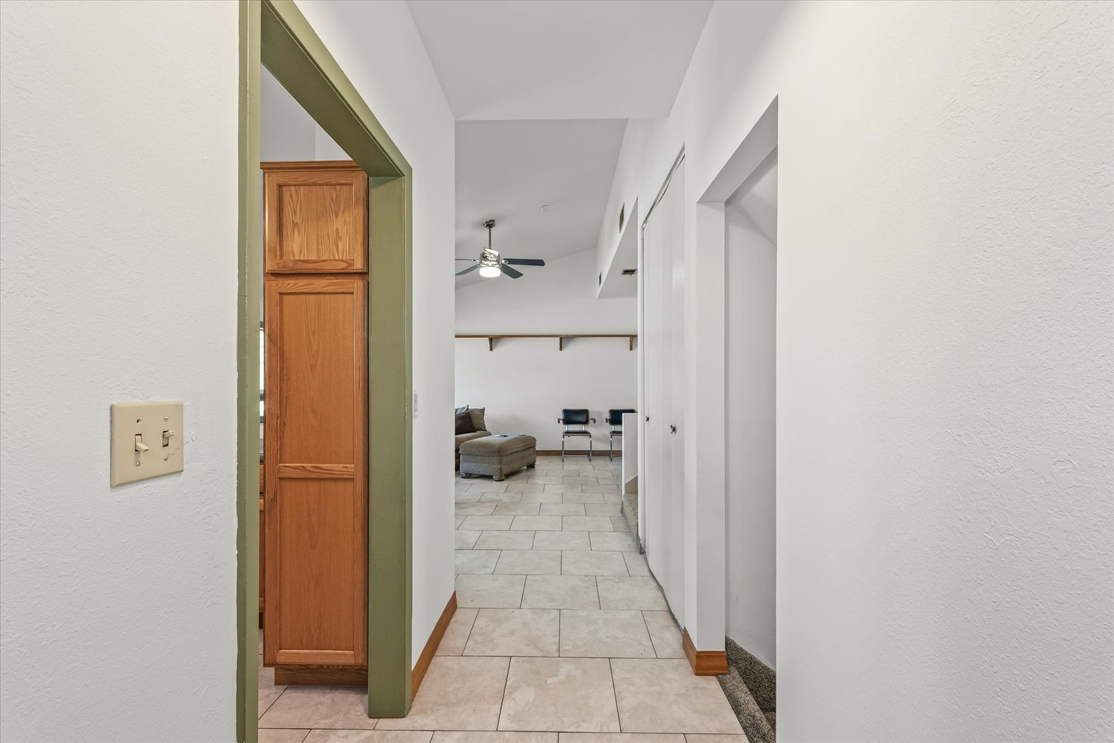 1602 Golfview Circle Rantoul, IL 61866 - Photo 13 of 36 a view of a hallway with wooden floor and a bathroom