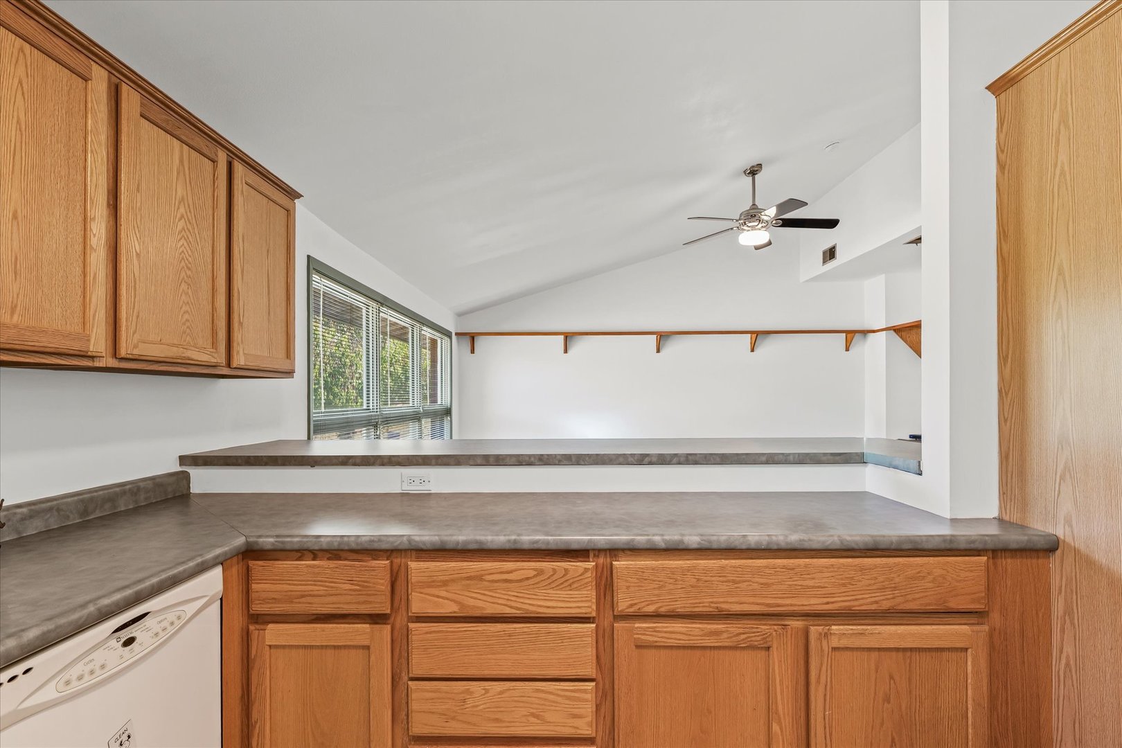 1602 Golfview Circle Rantoul, IL 61866 - Photo 16 of 36 a kitchen with a sink cabinets and a window