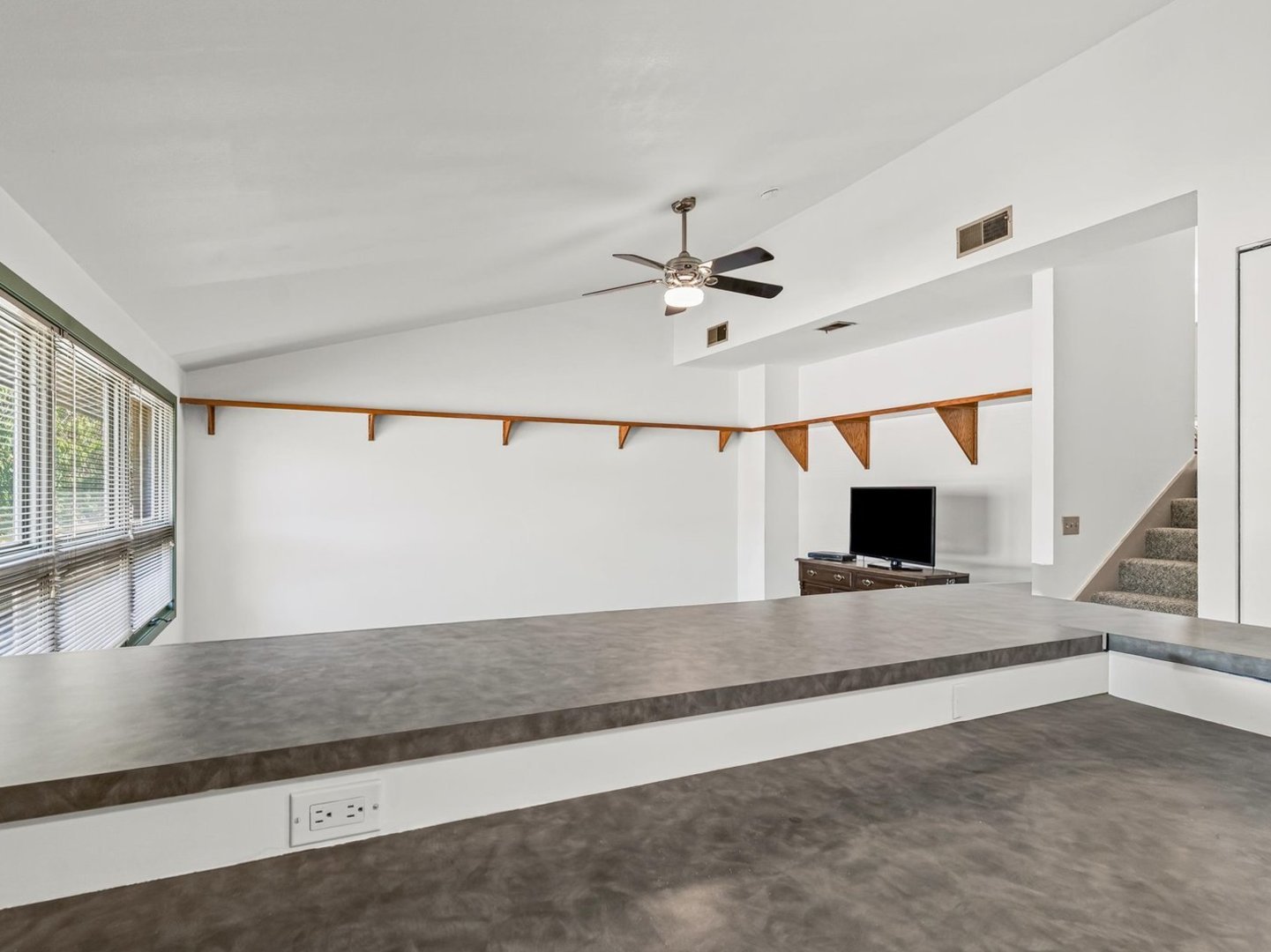 1602 Golfview Circle Rantoul, IL 61866 - Photo 17 of 36 a view of living room with a ceiling fan and window