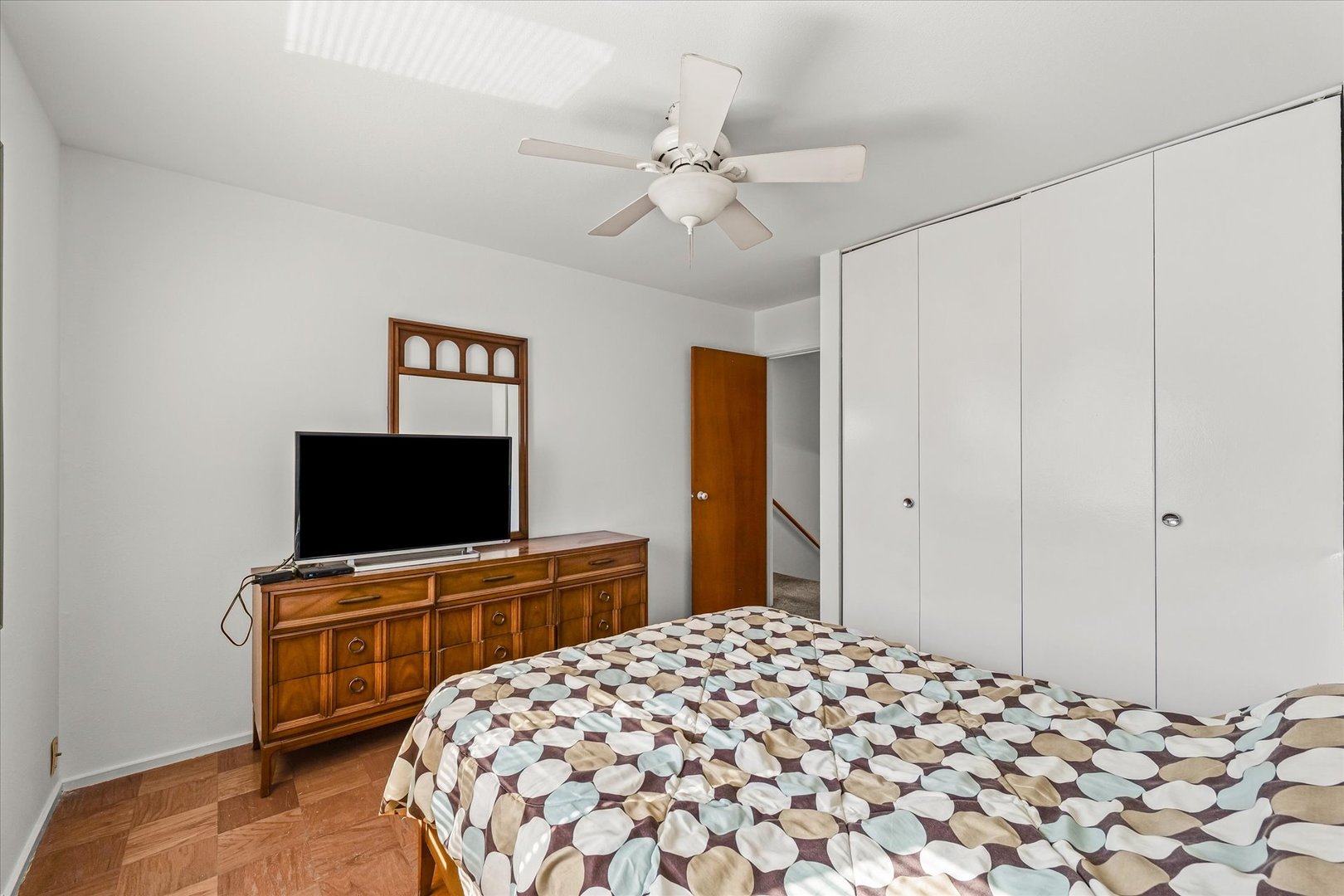 1602 Golfview Circle Rantoul, IL 61866 - Photo 20 of 36 a bedroom with a bed and a flat screen tv