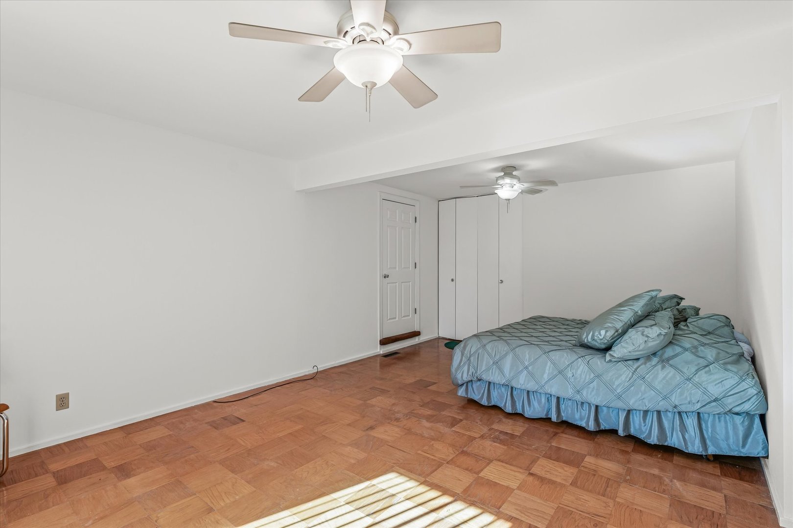 1602 Golfview Circle Rantoul, IL 61866 - Photo 21 of 36 a bedroom with a bed and a ceiling fan