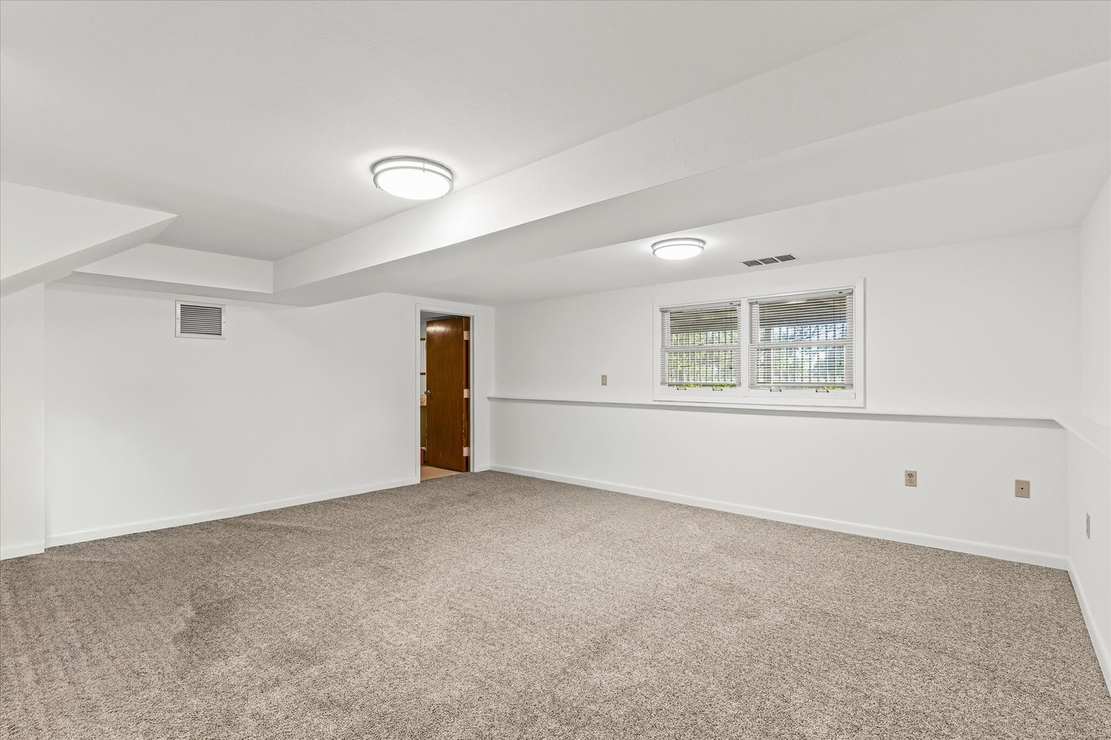 1602 Golfview Circle Rantoul, IL 61866 - Photo 27 of 36 an empty room with a empty space and window