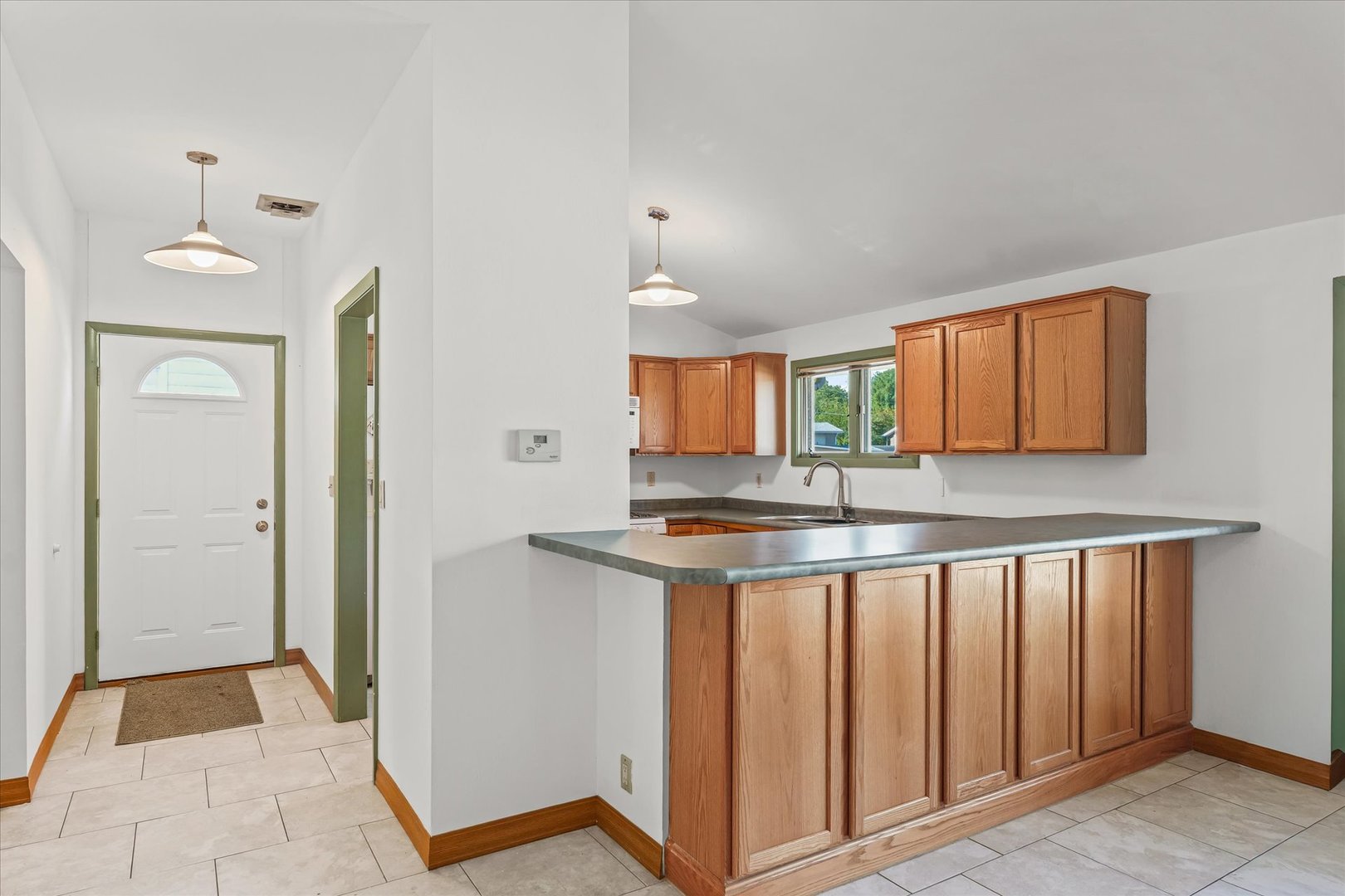 1602 Golfview Circle Rantoul, IL 61866 - Photo 8 of 36 a kitchen with stainless steel appliances granite countertop a stove and a sink