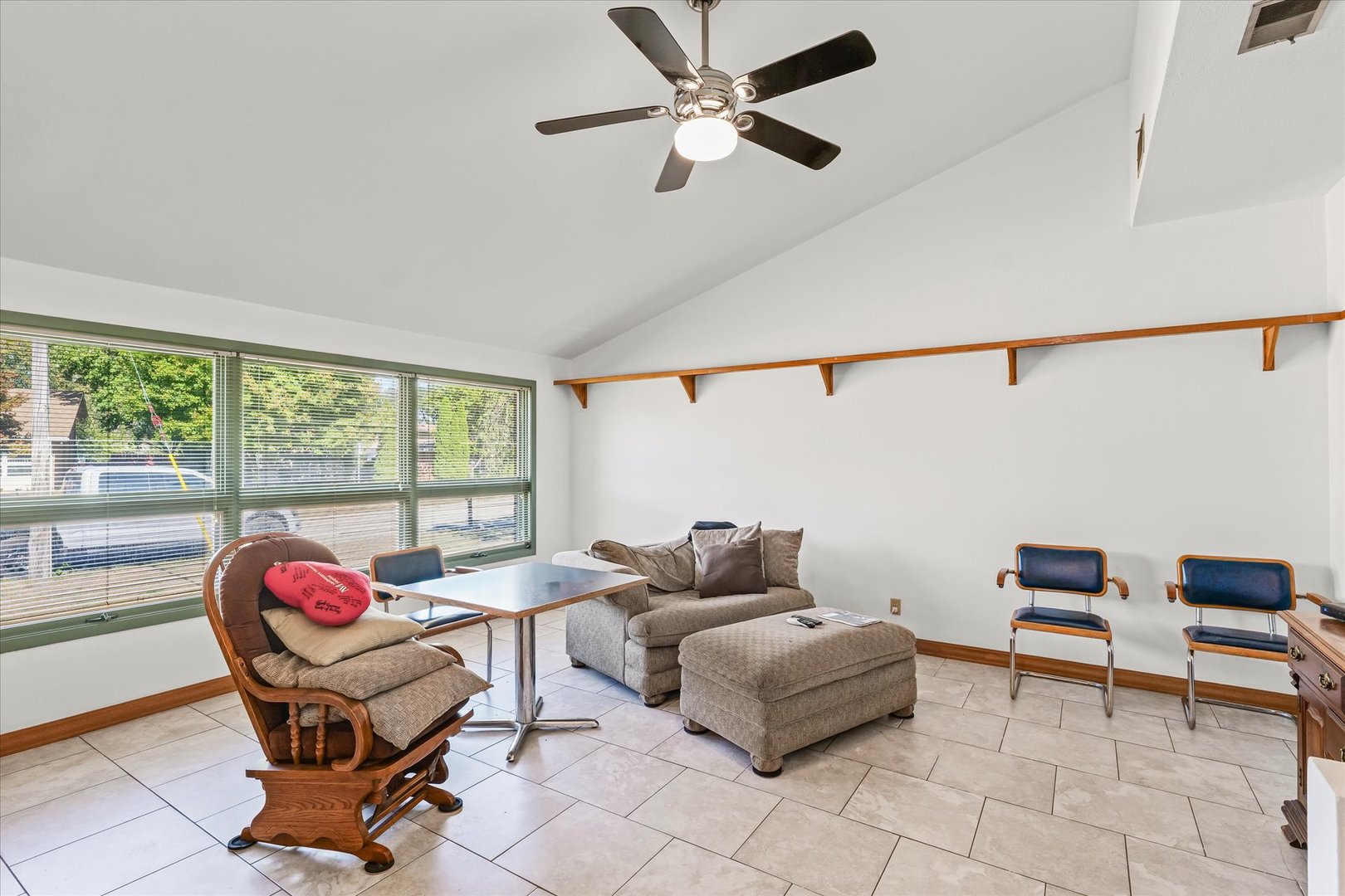 1602 Golfview Circle Rantoul, IL 61866 - Photo 9 of 36 a living room with furniture and a floor to ceiling window