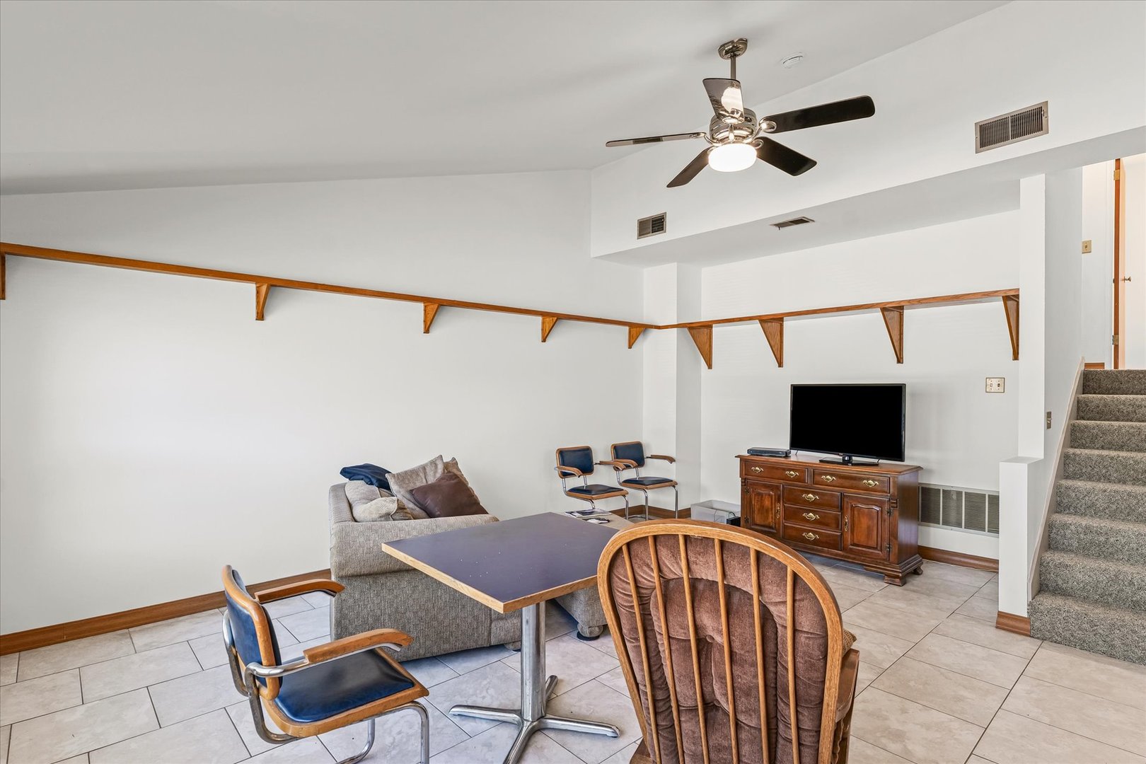 1602 Golfview Circle Rantoul, IL 61866 - Photo 10 of 36 a view of a livingroom with furniture and a flat screen tv