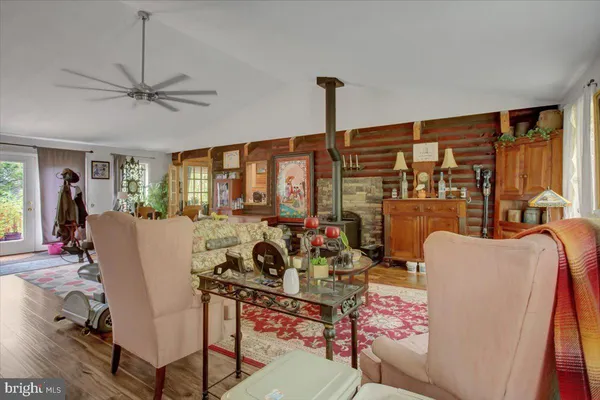 a view of living room filled with furniture and a potted plant