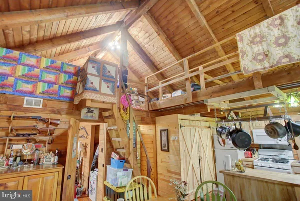 a view of a street with wooden fence