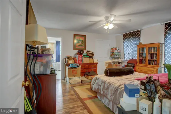 a bedroom with a bed and a table