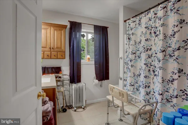 an aerial view of residential house with outdoor space and trees around