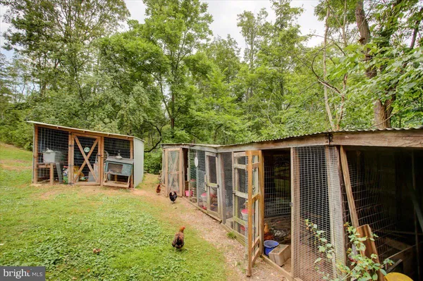 a backyard of a house with yard and outdoor seating