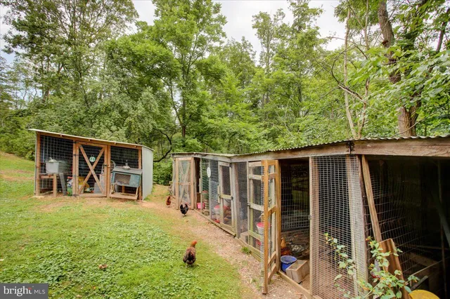 a backyard of a house with yard and outdoor seating