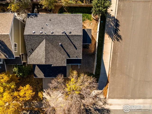 a aerial view of a house with a yard
