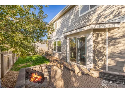 a view of house with backyard