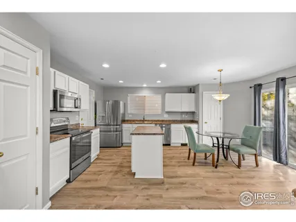 a kitchen with a table and chairs