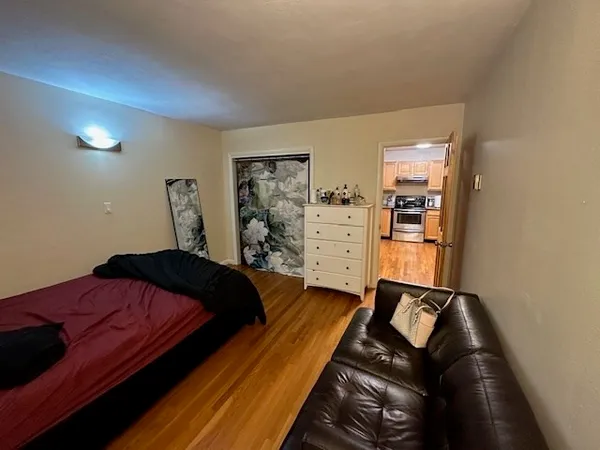 a bed room with a bed and a window