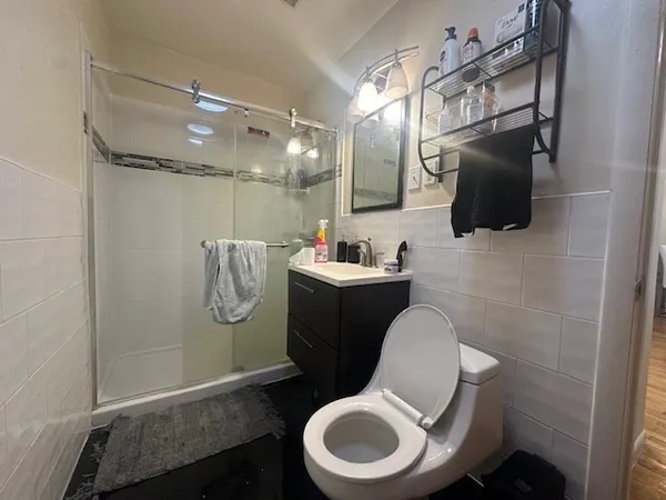 a bathroom with a toilet a sink and bathtub