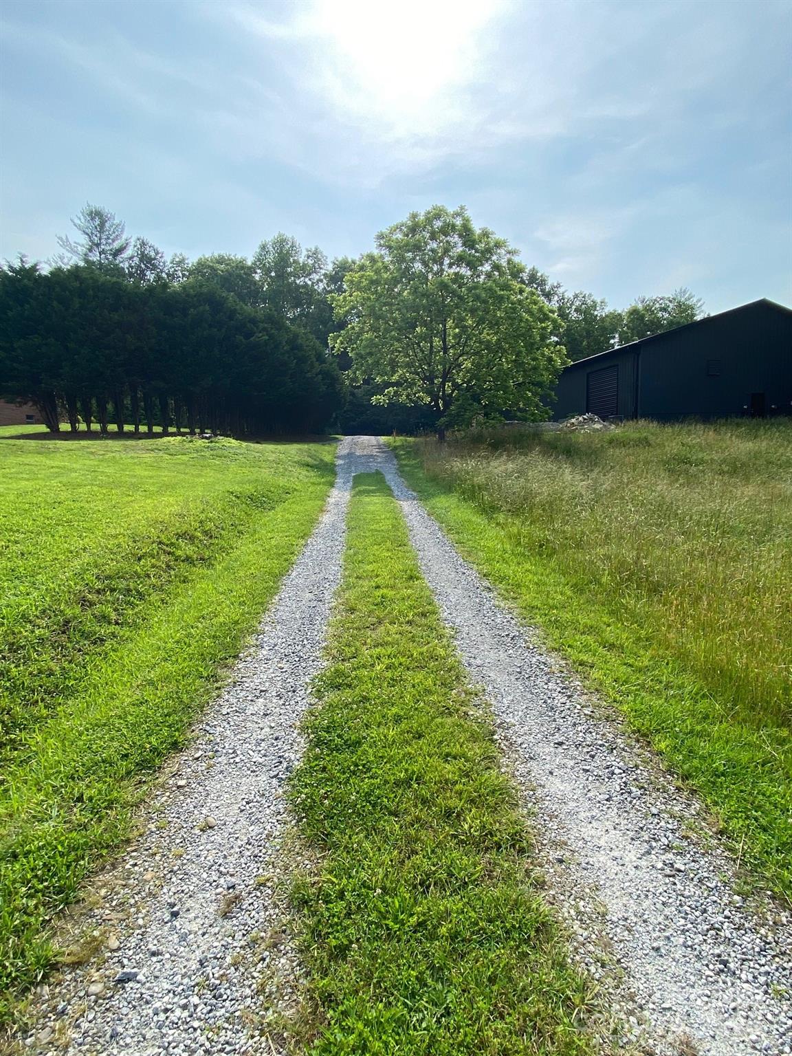 9999 Hunters Ridge Road, Unit 2 Mills River, NC 28759 - Photo 13 of 20 a view of a pathway with a yard