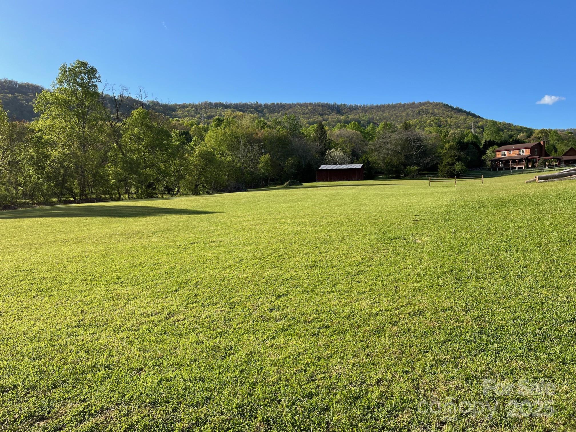 9999 Hunters Ridge Road, Unit 2 Mills River, NC 28759 - Photo 5 of 20 a view of an outdoor space and a lake view