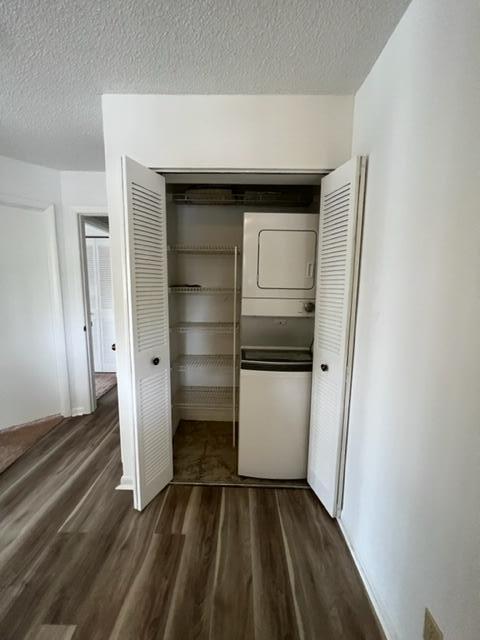6532 Chasewood Drive, Unit F Jupiter, FL 33458 - Photo 14 of 17 a view of an empty room and wooden floor