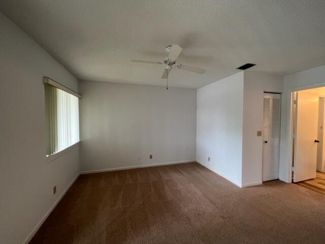 6532 Chasewood Drive, Unit F Jupiter, FL 33458 - Photo 17 of 17 a view of an empty room with a window