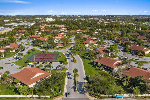 an aerial view of residential houses with outdoor space