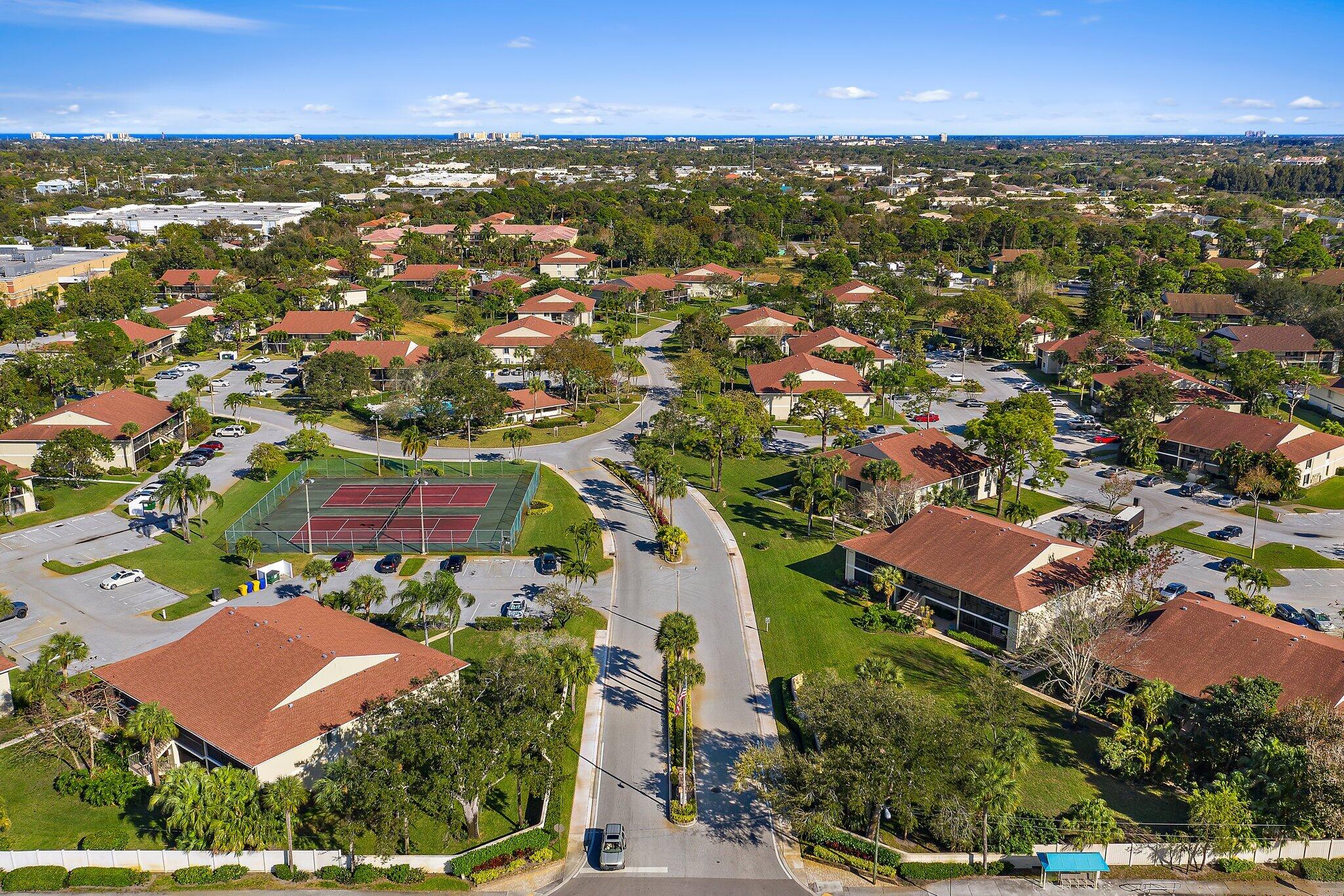 6532 Chasewood Drive, Unit F Jupiter, FL 33458 - Photo 6 of 17 an aerial view of residential houses with outdoor space
