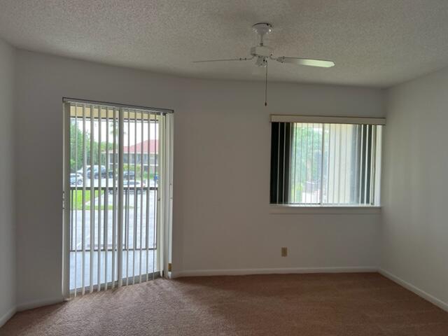 6532 Chasewood Drive, Unit F Jupiter, FL 33458 - Photo 10 of 17 an empty room with a window