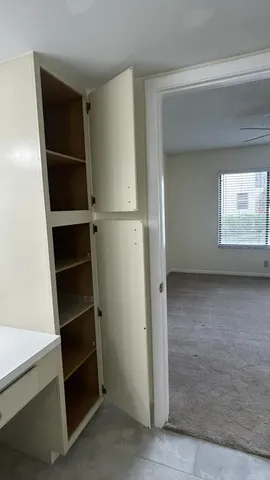 a view of an empty walk in closet