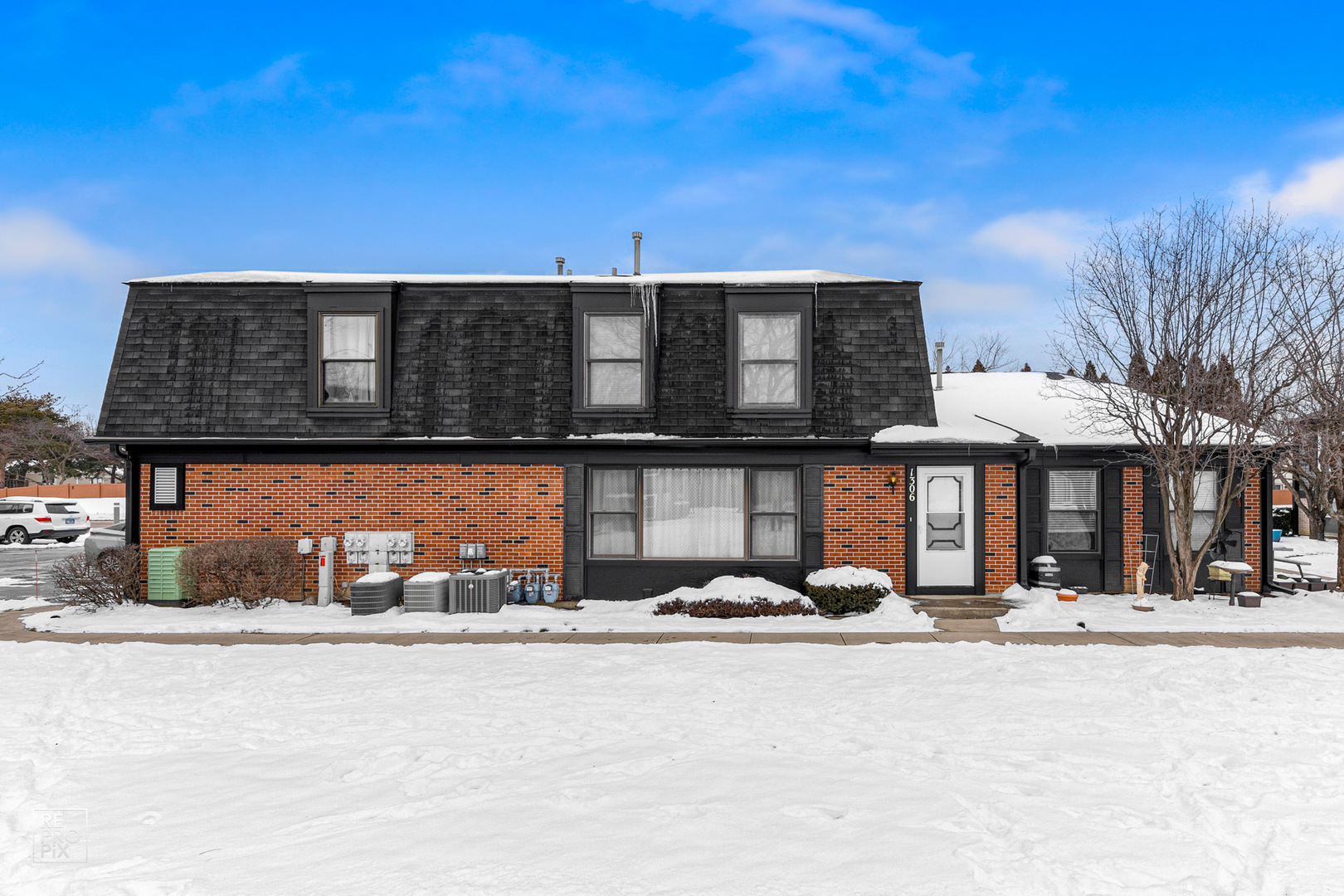 1306 Inverrary Lane, Unit 1306 Deerfield, IL 60015 - Photo 1 of 12 a front view of a building with cars