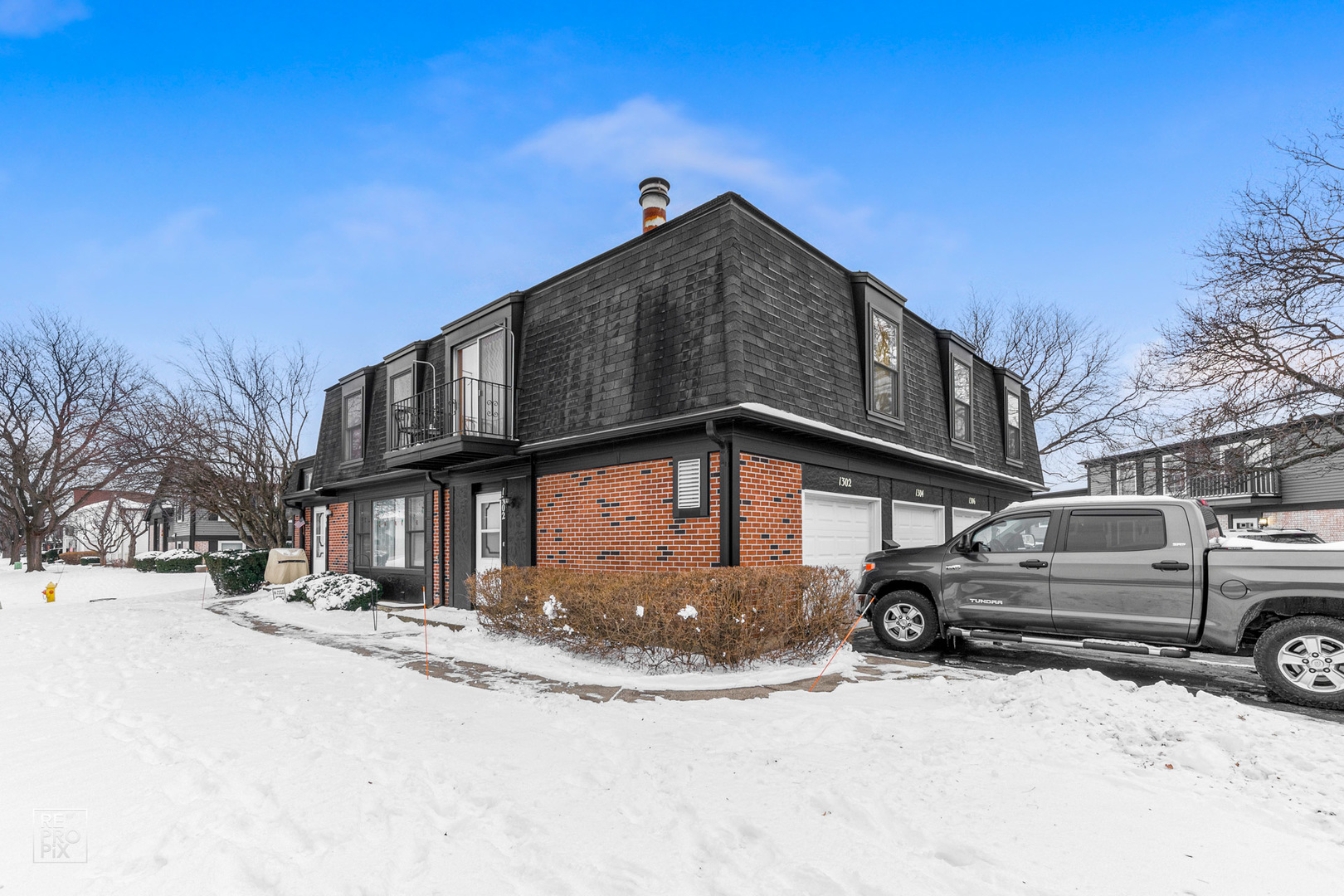 1306 Inverrary Lane, Unit 1306 Deerfield, IL 60015 - Photo 12 of 12 a view of a house with a snow in the yard