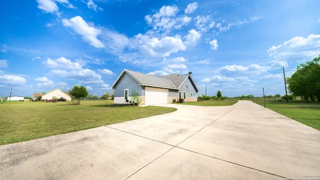 a house view with a garden space