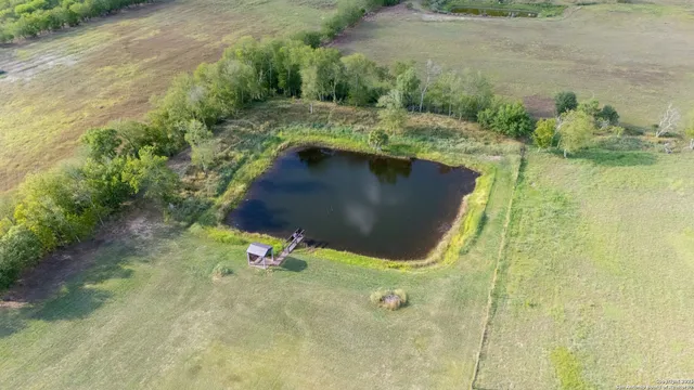 a view of a lake with a yard
