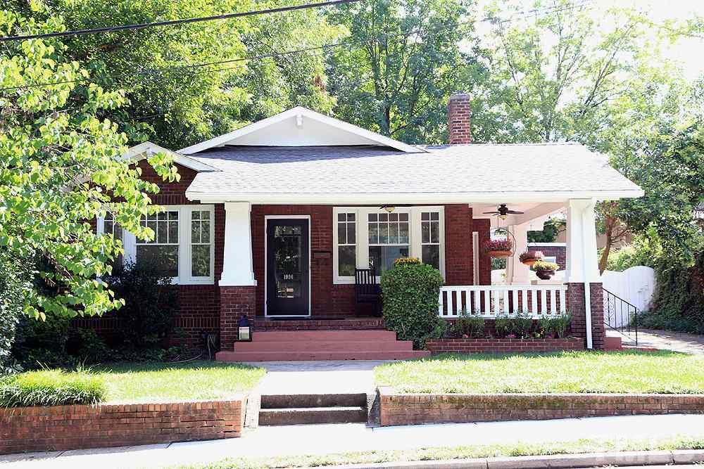 1906 Sunset Drive Raleigh, NC 27608 - Photo 2 of 21 a front view of a house with a garden