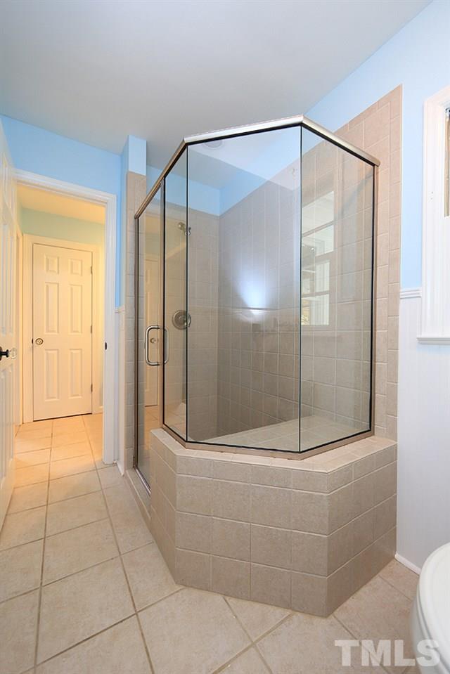 1906 Sunset Drive Raleigh, NC 27608 - Photo 17 of 21 a bathroom with a glass shower door