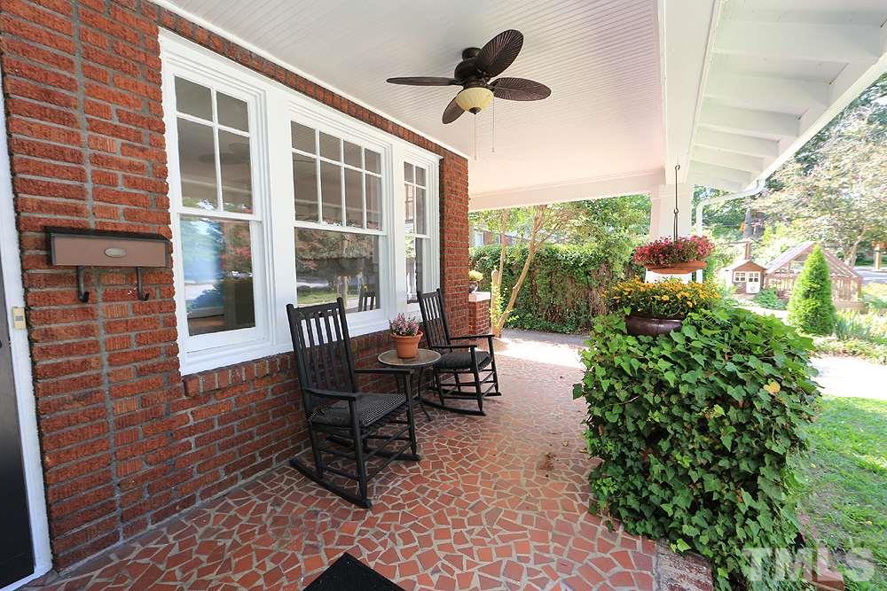 1906 Sunset Drive Raleigh, NC 27608 - Photo 4 of 21 a balcony with furniture and a potted plant