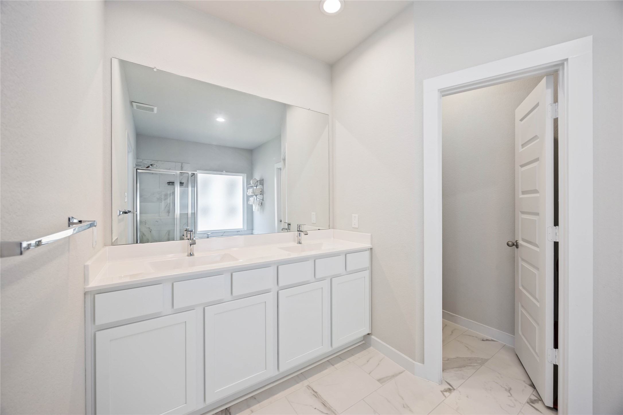 15038 Timberson Rdg Lane Houston, TX 77090 - Photo 19 of 29 a bathroom with a double vanity sink and mirror
