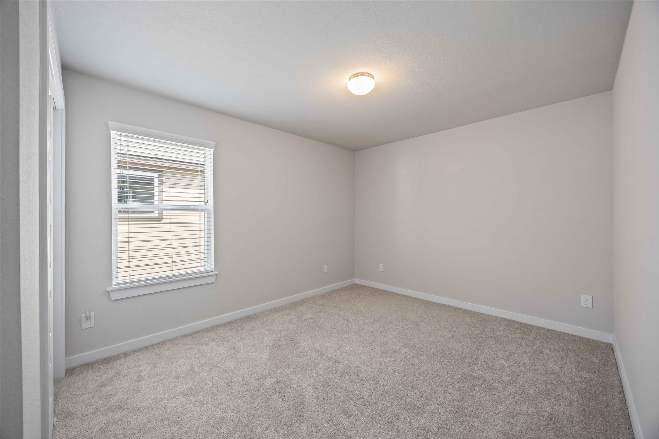 15038 Timberson Rdg Lane Houston, TX 77090 - Photo 22 of 29 an empty room with a window