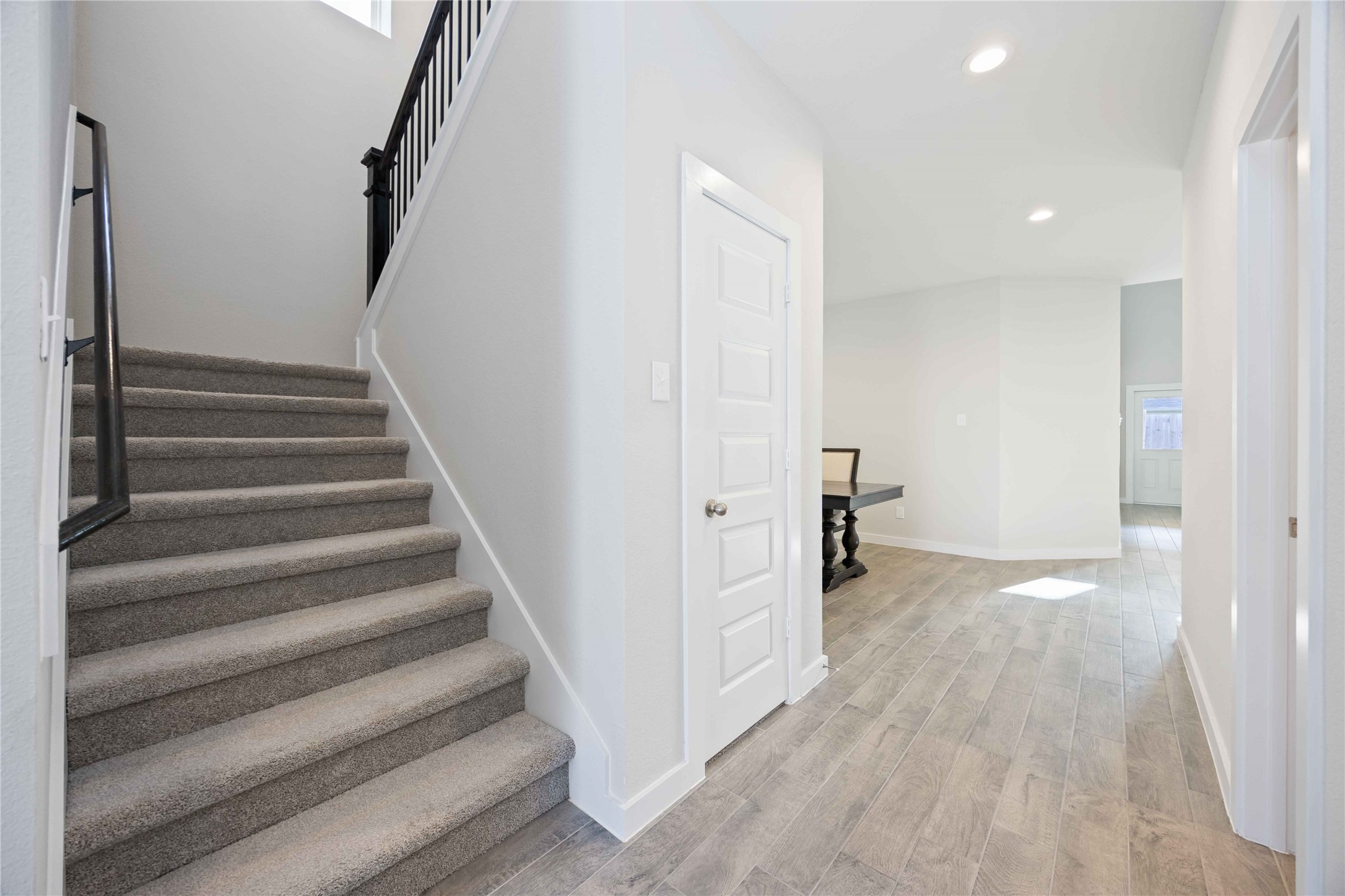 15038 Timberson Rdg Lane Houston, TX 77090 - Photo 6 of 29 a view of a hallway with wooden floor and entryway