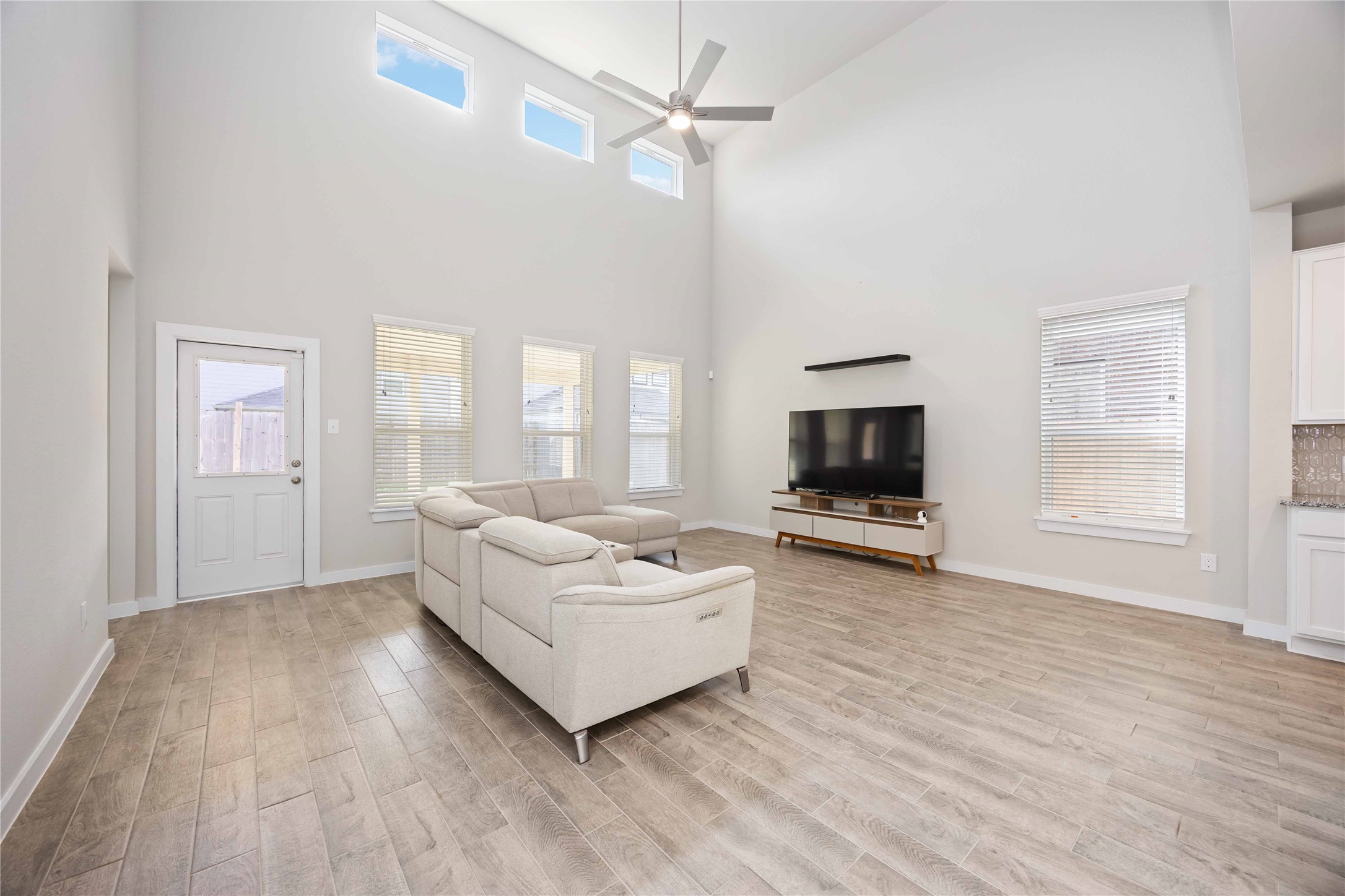 15038 Timberson Rdg Lane Houston, TX 77090 - Photo 7 of 29 a living room with furniture and a flat screen tv