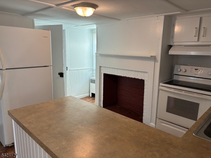 43 Old Turnpike Road Oldwick, NJ 08858 - Photo 12 of 18 a kitchen with a stove and a refrigerator