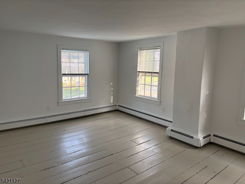 43 Old Turnpike Road Oldwick, NJ 08858 - Photo 14 of 18 an empty room with wooden floor and windows