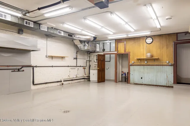 a front view of a house with outdoor seating