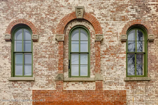 a view of a brick house with a windows