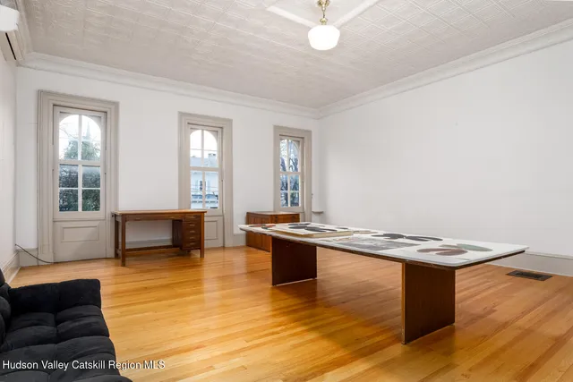 a living room with kitchen island granite countertop furniture and a fireplace