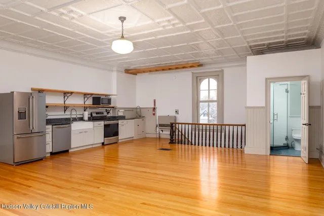 a view of kitchen with microwave and stove