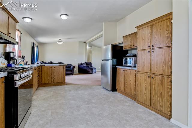 7505 Harding Road Rush, CO 80833 - Photo 6 of 33 KITCHEN VIEWS TO DINING ROOM
