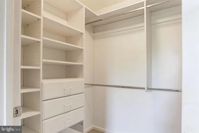 a view of an empty walk in closet
